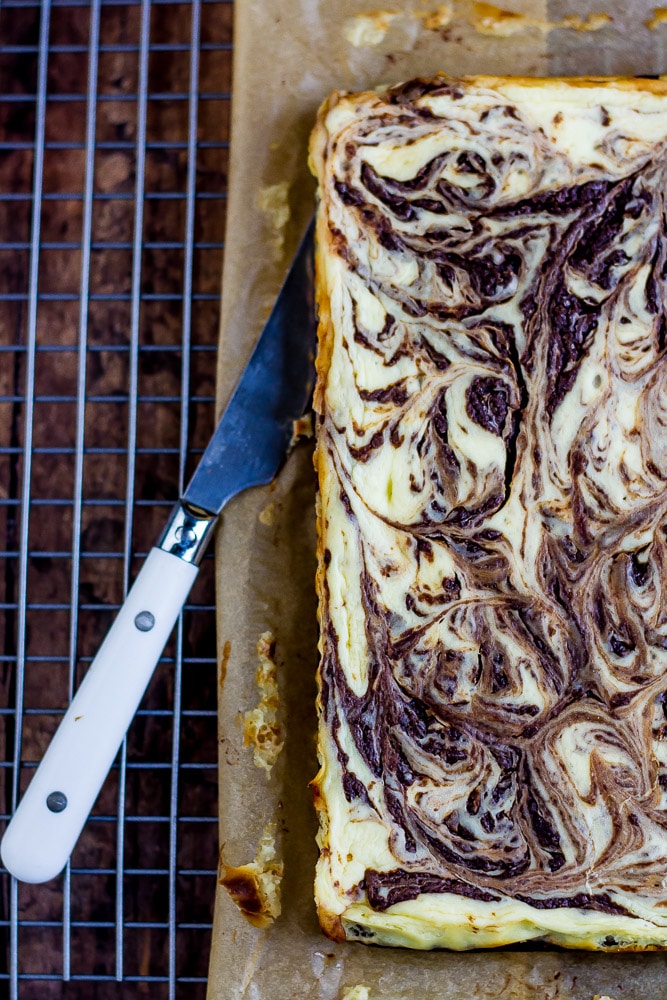 Fancy Keto Brownie Cheesecake Bars swirled and pretty.