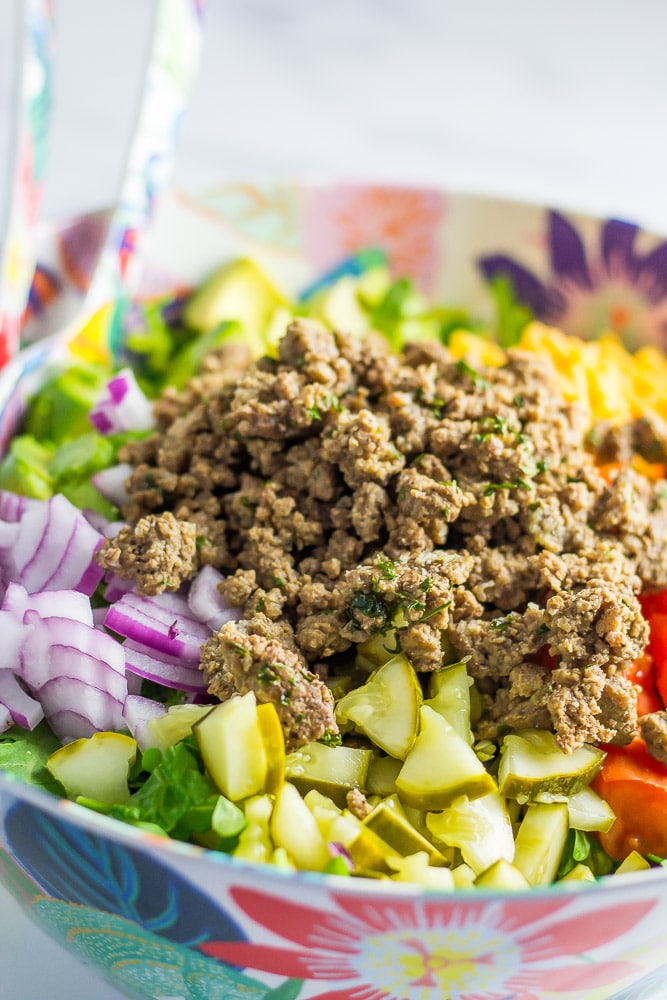 I swear the secret is in seasoning the meat...otherwise you just have meat over a salad. Then add in everything you’d find on a burger ESPECIALLY the pickle and you’ve got the best damn Cheeseburger Salad EVER!