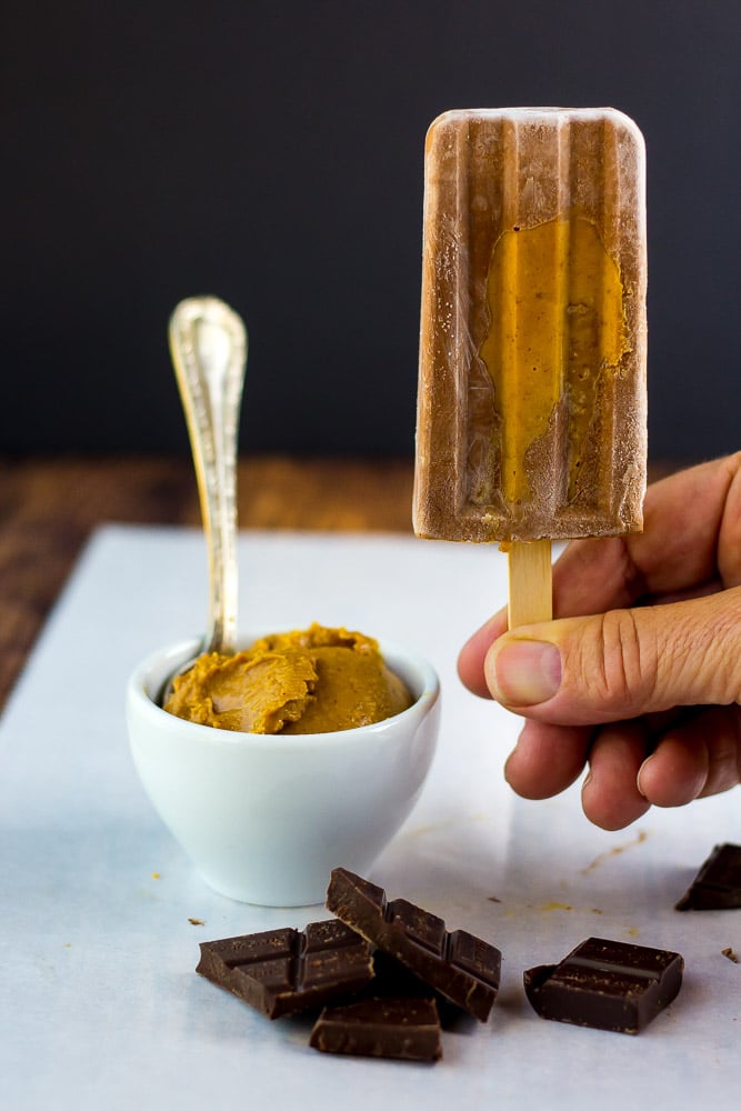 Besides being totally addicted to the flavor combo of peanut butter and chocolate I like that these frozen Chocolate Peanut Butter Fudge Bars are only 4g net carbs and they take time to eat.